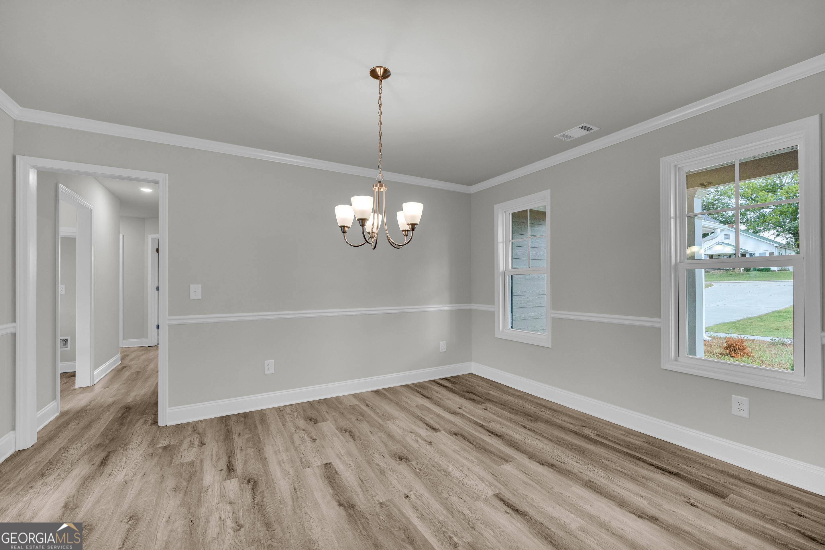 110 Sewell Road Lavonia, GA 30553 - Photo 23 of 73 a view of empty room with wooden floor and fan
