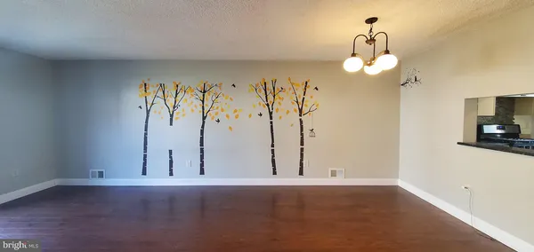 a kitchen with a refrigerator sink and cabinets