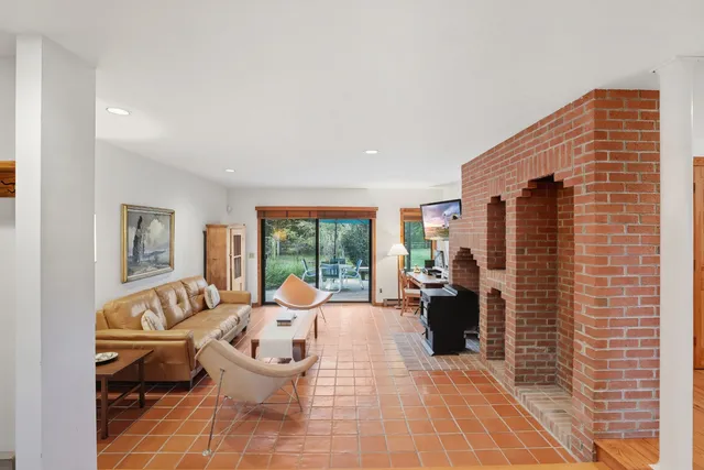 a kitchen with a refrigerator and a sink