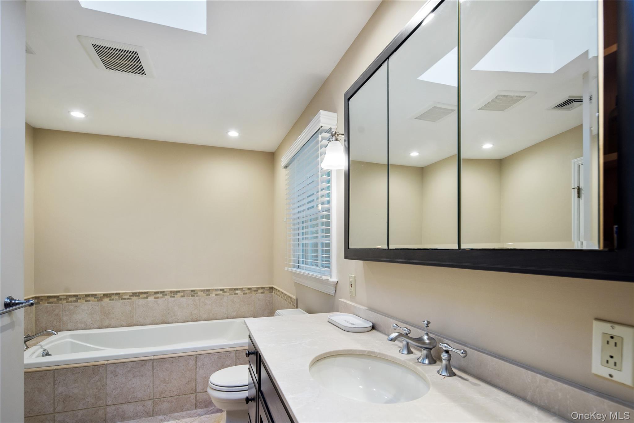 105 Cross Ridge Road Chappaqua, NY 10514 - Photo 31 of 43 Recessed lighting, a skylight and an inset marble border