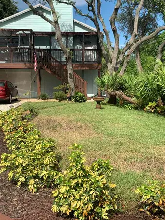 a backyard of a house with lots of green space