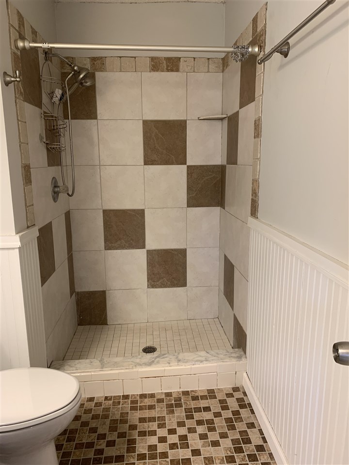 6484 Brevard Street St. Augustine, FL 32080 - Photo 14 of 20 a bathroom with a toilet and a shower