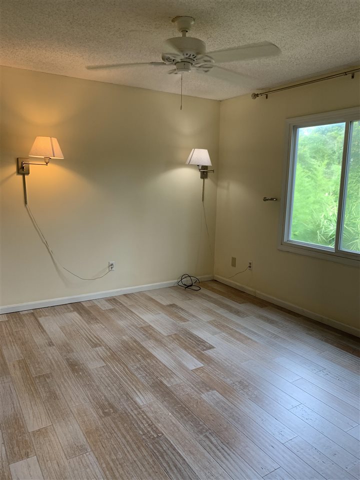 6484 Brevard Street St. Augustine, FL 32080 - Photo 15 of 20 a view of a room with wooden floor and fan