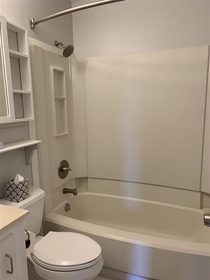 6484 Brevard Street St. Augustine, FL 32080 - Photo 17 of 20 a bathroom with a toilet and shower