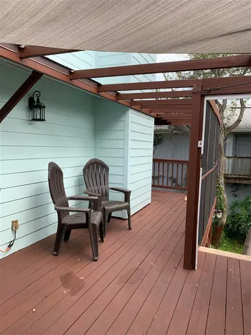 a view of a two chairs and table in a balcony