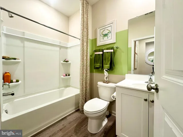 a bathroom with a toilet sink and shower