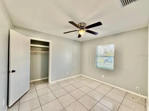 a view of an empty room with a window