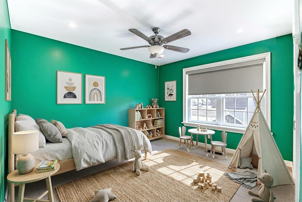 5123 Milam Street Dallas, TX 75206 - Photo 14 of 40 a bedroom with a bed and a window
