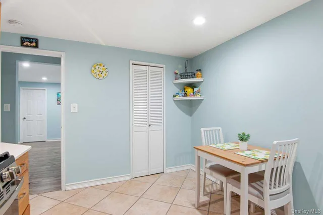 a room with a table and chairs