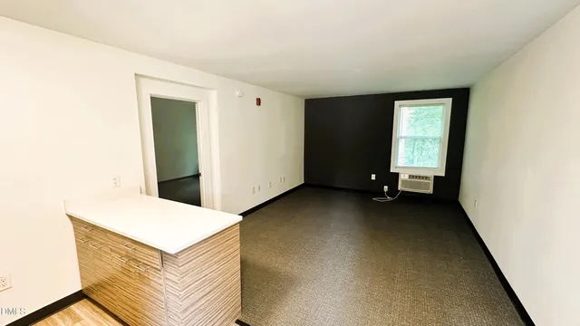 a view of an empty room and window