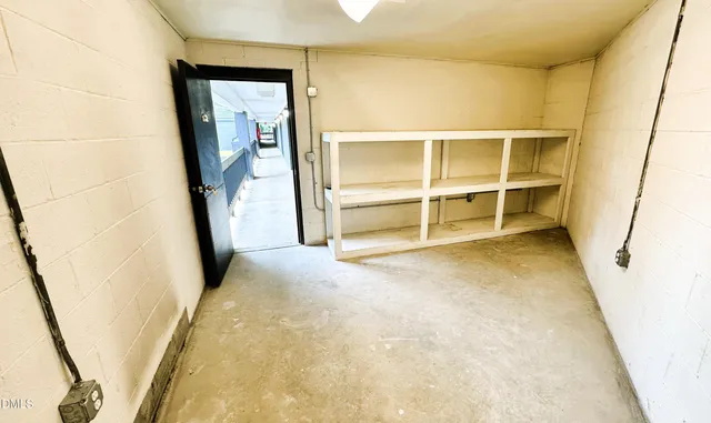 a view of an empty room with a bathroom