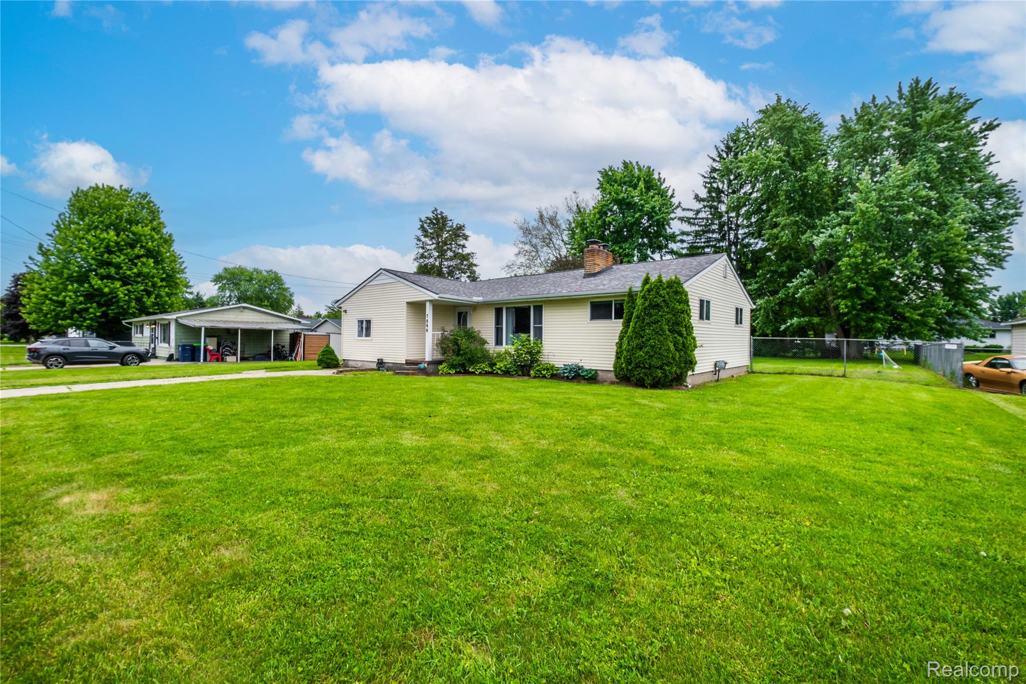 7800 Maple Street Birch Run, MI 48415 - Photo 17 of 29 Ranch-style residence featuring a pale yellow exterior, a gabled roof, and a prominent front lawn