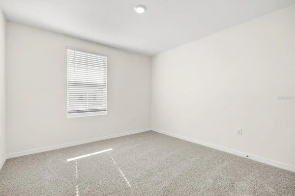 an empty room with closet area