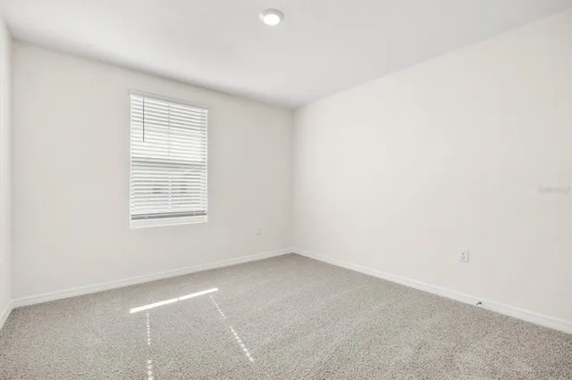 an empty room with closet area