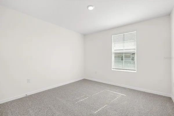 an empty room with closet area