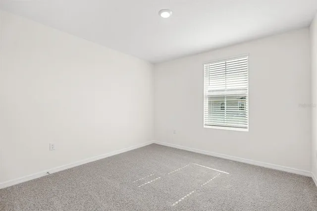 an empty room with closet area
