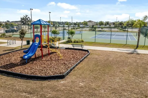 a view of swimming pool with outdoor seating