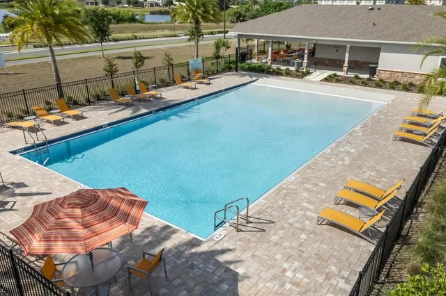 a view of swimming pool with a yard