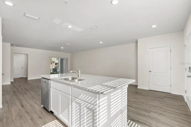 a kitchen that has a sink and a stove