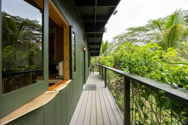 a view of balcony with wooden floor