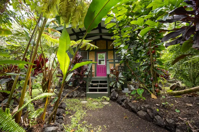a kitchen with sink and large window