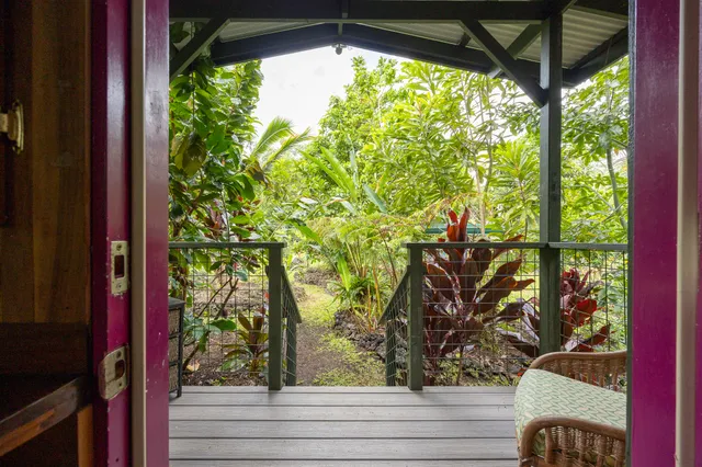 a view of a large swimming pool with outdoor seating