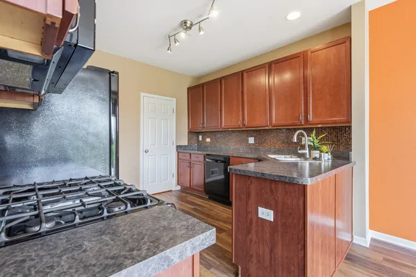 a kitchen with a stove and a refrigerator