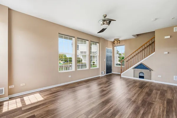 a view of an entryway with wooden floor