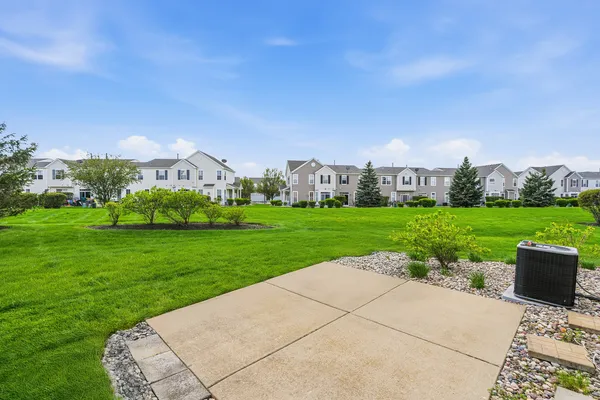 a view of a garden with a house