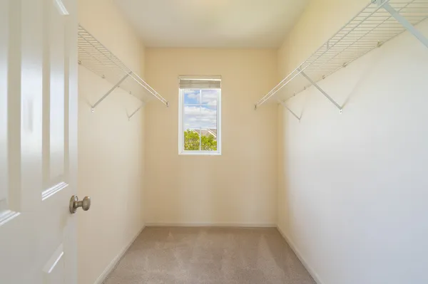 a view of small space with empty racks on the wall