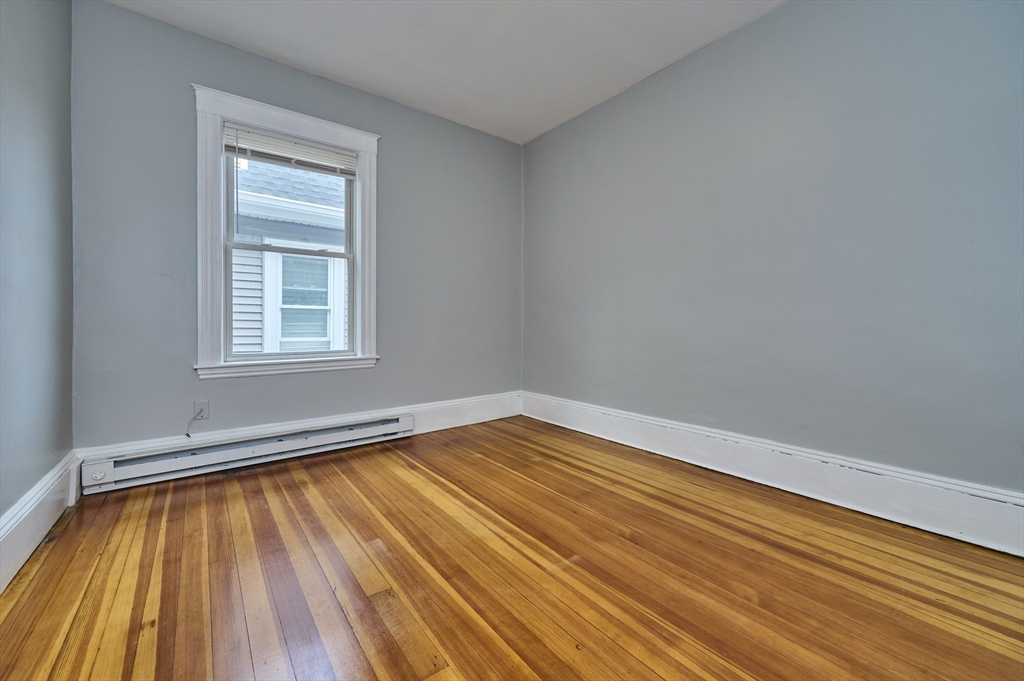 41 Salem Street, Unit 2L Salem, MA 01970 - Photo 12 of 18 a view of empty room with wooden floor and fan