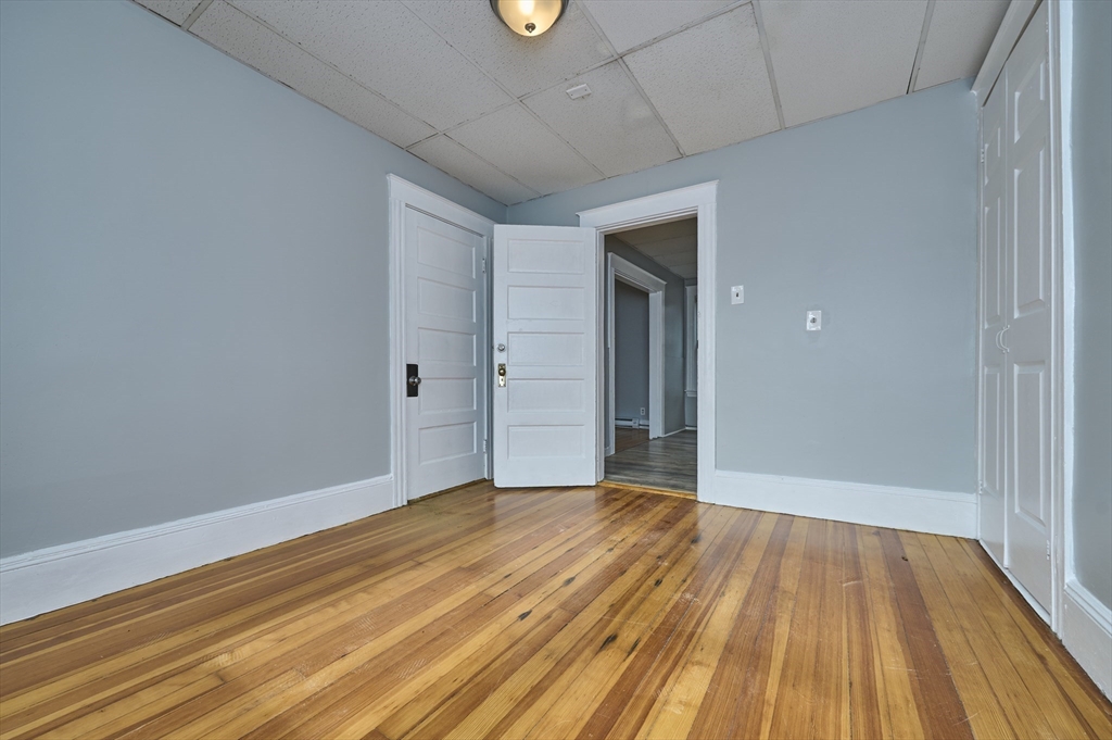 41 Salem Street, Unit 2L Salem, MA 01970 - Photo 13 of 18 a view of an empty room with wooden floor