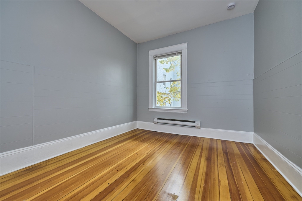 41 Salem Street, Unit 2L Salem, MA 01970 - Photo 6 of 18 a view of empty room with window and wooden floor