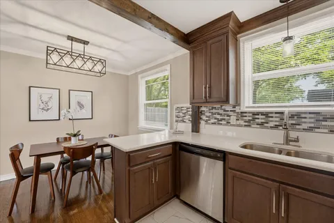 a kitchen with a sink and a window