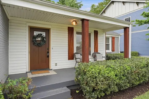 a front view of a house with garden