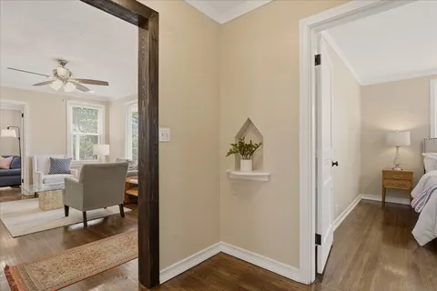 a view of a livingroom with wooden floor and a cabinet