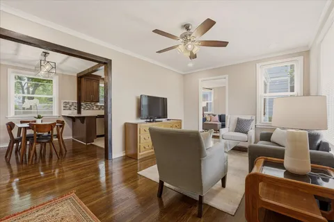 a view of a dining room with furniture and wooden floor