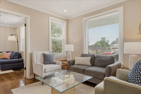 a living room with furniture and a window