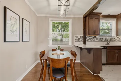 a view of a dining room with furniture window and outside view