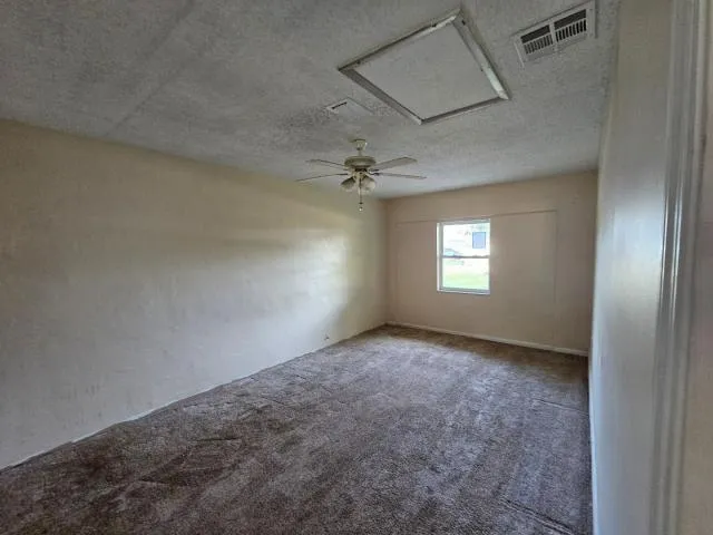 an empty room that has a window in it
