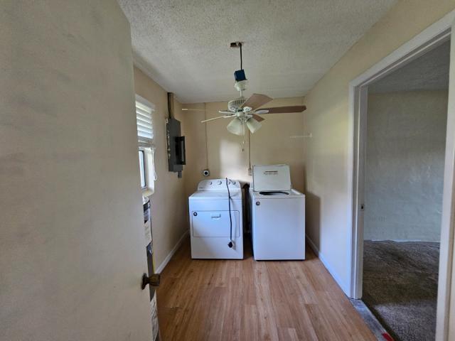 3261 Southwest 22nd Street Okeechobee, FL 34974 - Photo 7 of 15 a view of a kitchen from a hallway