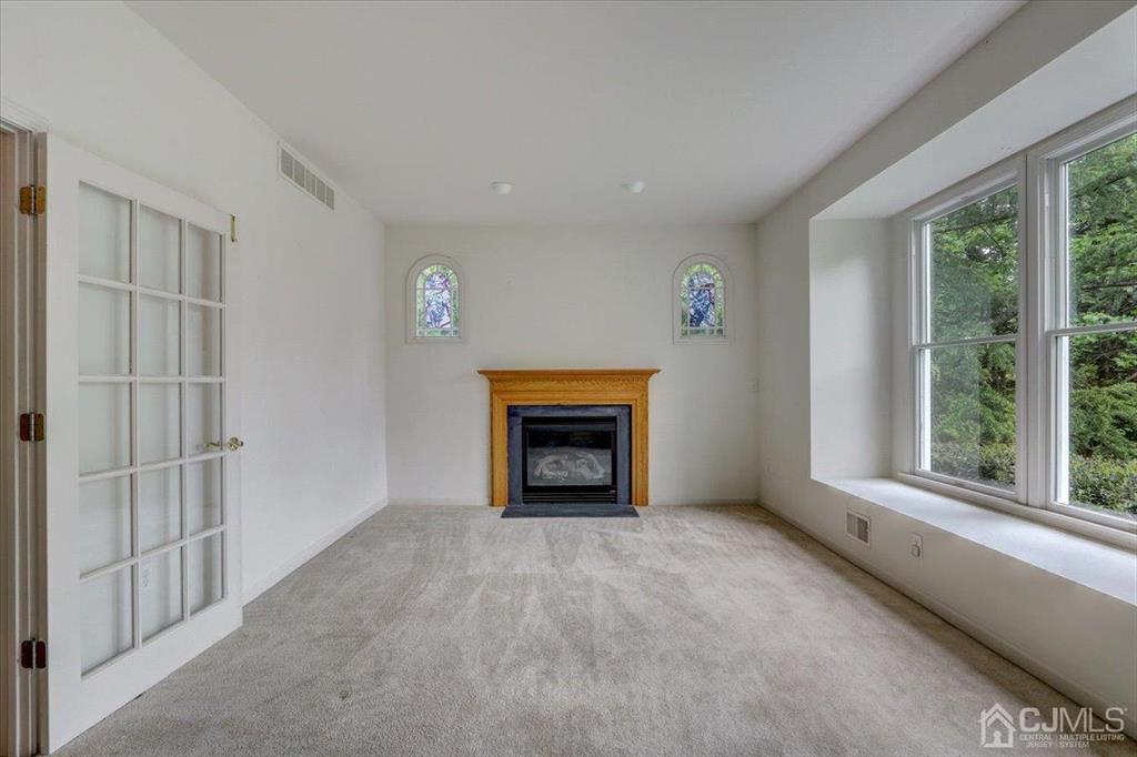 100 North Main Street Cranbury, NJ 08512 - Photo 11 of 74 a view of an empty room with window and fire place