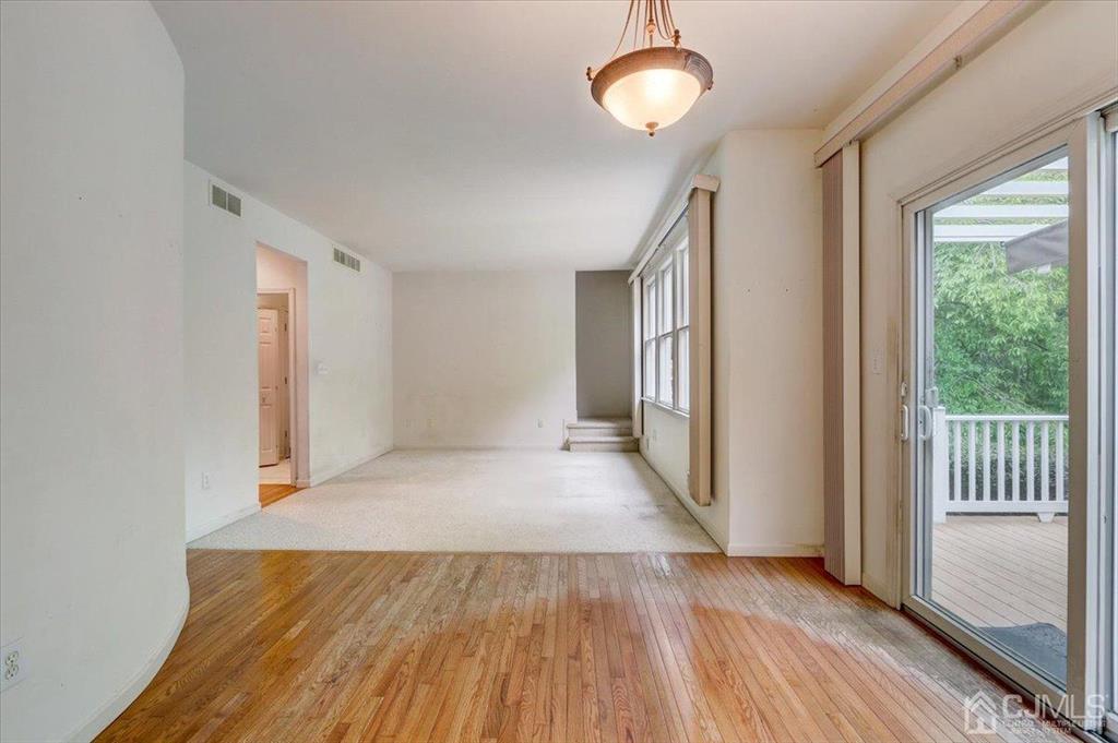 100 North Main Street Cranbury, NJ 08512 - Photo 18 of 74 a view of a room with wooden floor and window