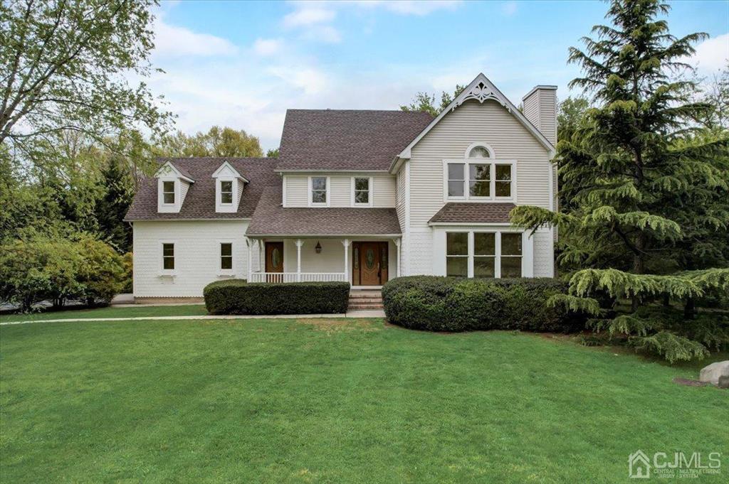 100 North Main Street Cranbury, NJ 08512 - Photo 2 of 74 a front view of a house with a garden