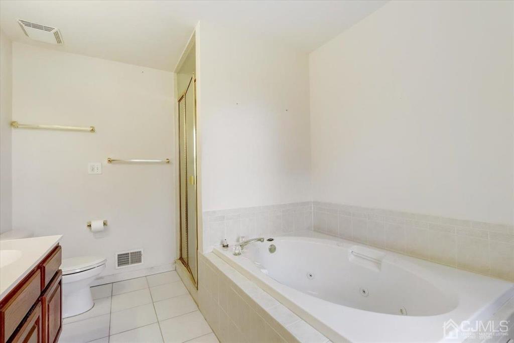 100 North Main Street Cranbury, NJ 08512 - Photo 26 of 74 a bathroom with a bathtub and toilet
