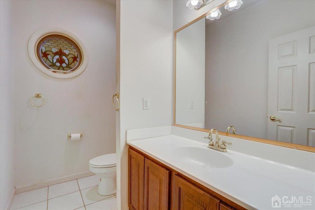 100 North Main Street Cranbury, NJ 08512 - Photo 35 of 74 a bathroom with a sink and a toilet