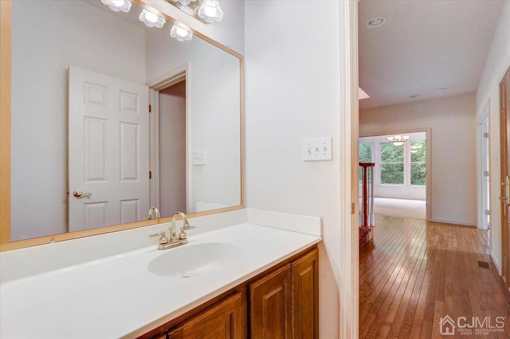 100 North Main Street Cranbury, NJ 08512 - Photo 37 of 74 a bathroom with a sink and a mirror