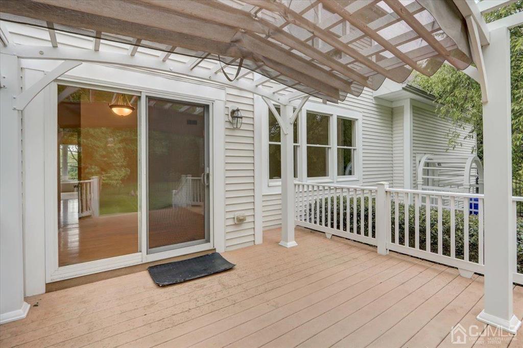 100 North Main Street Cranbury, NJ 08512 - Photo 49 of 74 a view of a porch with wooden floor and iron stairs