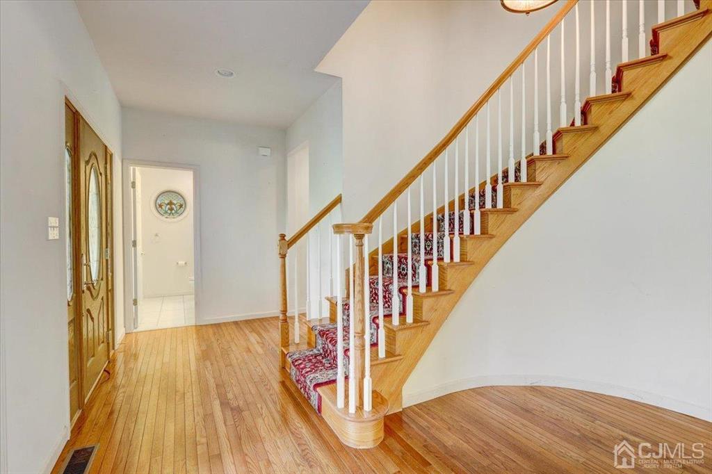 100 North Main Street Cranbury, NJ 08512 - Photo 6 of 74 a view of entryway with wooden floor