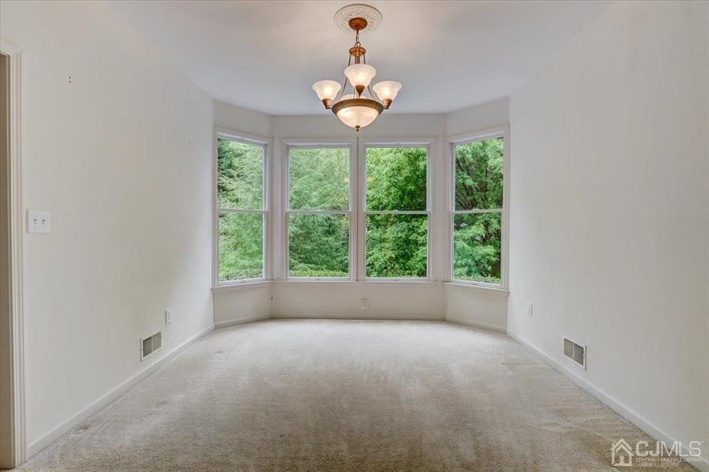 100 North Main Street Cranbury, NJ 08512 - Photo 9 of 74 a view of room with window and ceiling fan